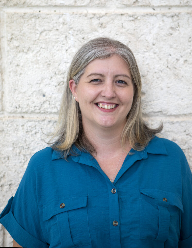 Tutor Kirsty W. of Corestone Tutors — expert in IB English A (Language & Literature) and Extended Essay guidance — pictured ready to support students.